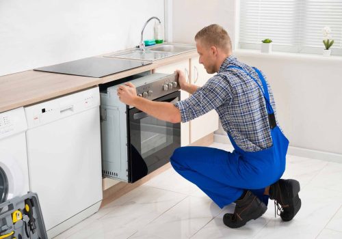 Handyman Services homeguide appliance technician installing an oven appliance installation